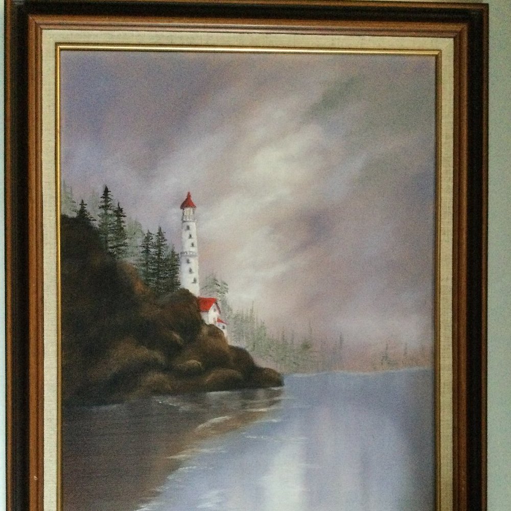 Original painting framed seaside cliff trees and a lighthouse signed